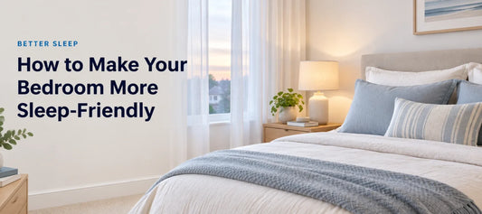 A calm, softly lit bedroom with light bedding, a warm bedside lamp and tidy surfaces, with the headline How to Make Your Bedroom More Sleep-Friendly
