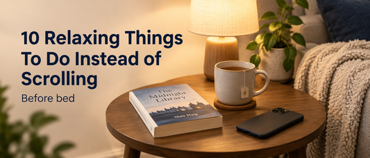 Book, tea and a phone face down beside a sofa, with the text 10 Relaxing Things To Do Instead of Scrolling