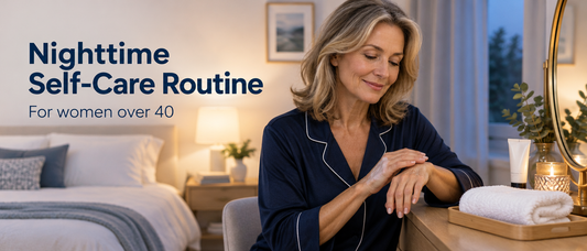 Woman applying hand cream at a dressing table in soft evening light, with the text Nighttime Self-Care Routine