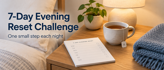 Seven-day planner with tick marks beside a lamp and tea, with the text 7-Day Evening Reset Challenge